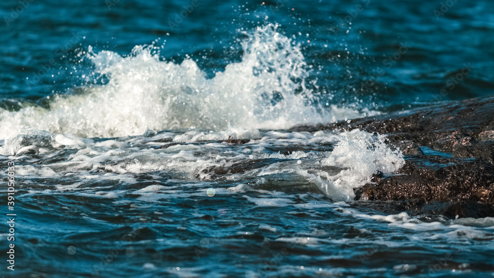 Close up of waves crashing on a rocky shore Close up of waves crashing on a rocky shore