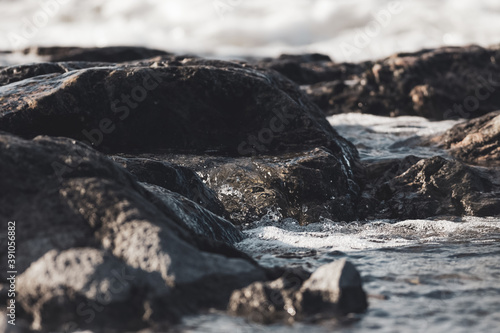Close up of waves crashing on a rocky shore