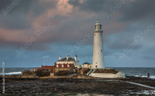 Wallpaper Mural Big Clouds hang over St. Mary's Lighthouse in Whitley Bay at low tide, with the tidal causeway in view Torontodigital.ca