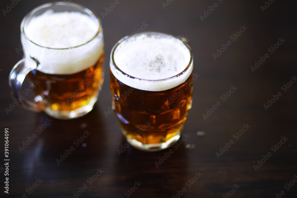 Glass of fresh beer on a wooden table. Lager beer mug on stone table. Top view with copy space Glass of fresh beer on a wooden table. Lager beer mug on stone table. Top view with copy space