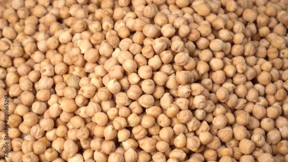Uncooked chickpeas close up. Fresh raw food. Cicer arietinum. Rotation Uncooked chickpeas close up. Fresh raw food. Cicer arietinum. Rotation