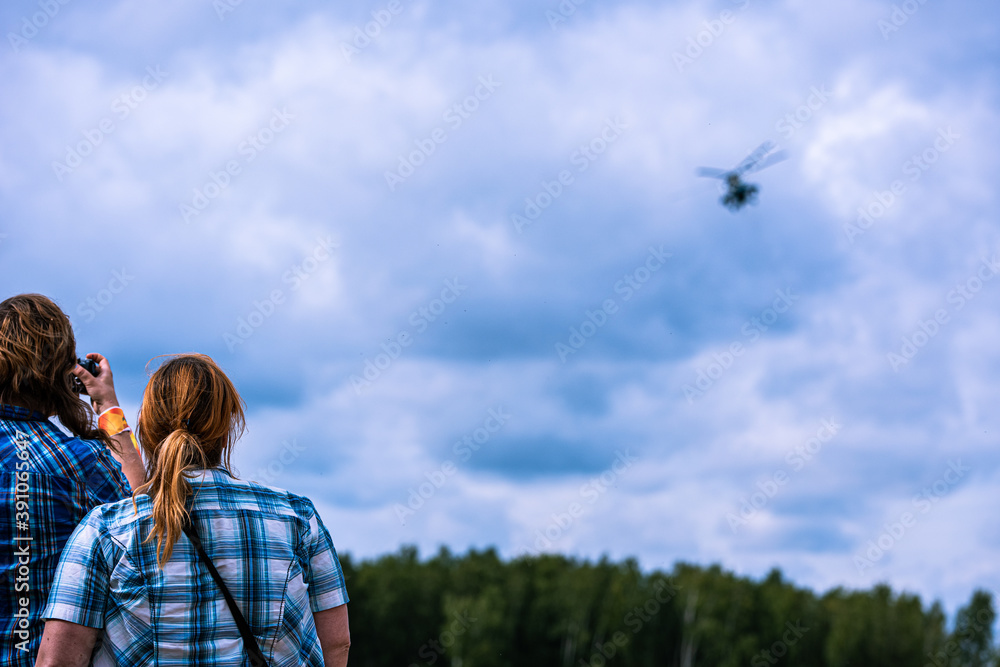 An army helicopter flying over a training battlefield An army helicopter flying over a training battlefield