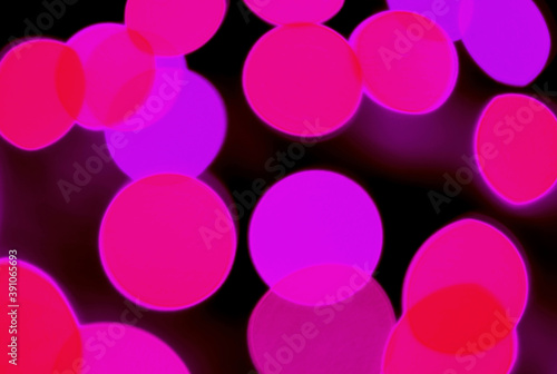 Abstract Blurred Hot Pink and Purple Color Illuminated Light Splashing on Dark Background
