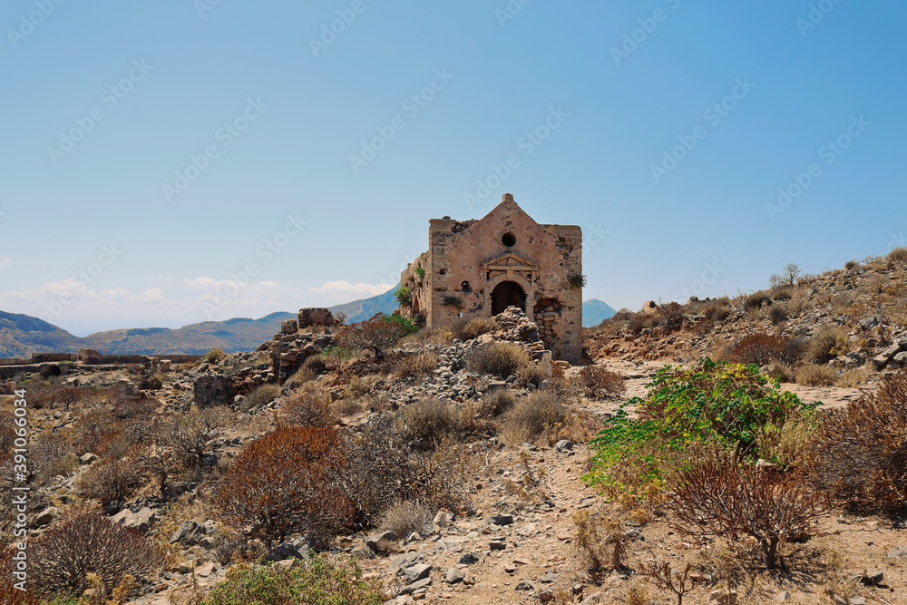 Gramvousa island church ruin. Greece excursion to historic tourist landmark. Old stone architecture in Crete.
