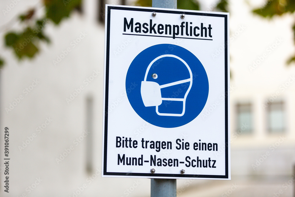 Info sign in a german city with german text. Maskenpflicht, Bitte tragen Sie einen Mund-Nasen-Schutz. Mask compulsory, please wear mouth and nose protection. Info sign in a german city with german text. Maskenpflicht, Bitte tragen Sie einen Mund-Nasen-Schutz. Mask compulsory, please wear mouth and nose protection.