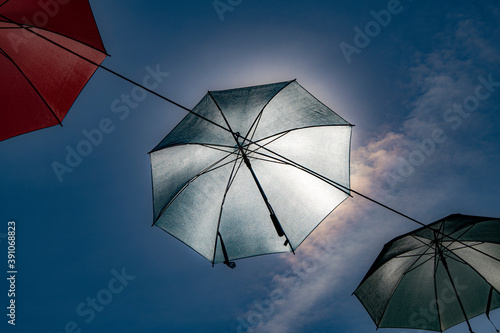 umbrellas on blue sky background