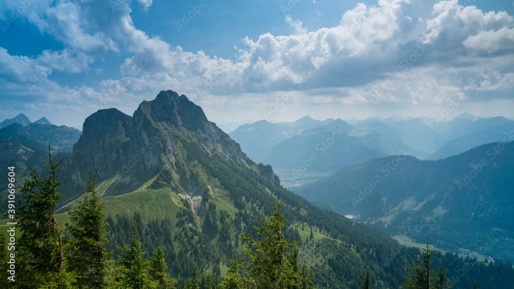 Germany, Allgaeu, Aggenstein, Impressive high mountain view from above, countless green trees covering nature scenery