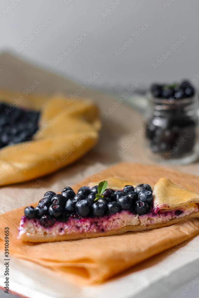 A piece of cake with cottage cheese and blueberries