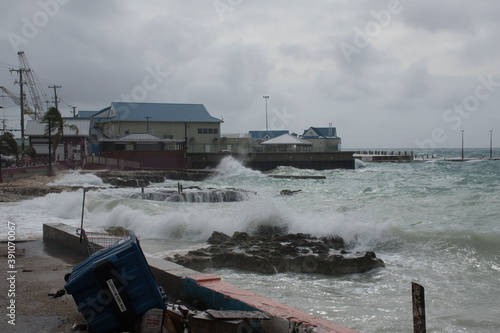 Waves crashing into the shore in Georgetown , Grand Cayman caused by hurricane Zeta nearby photo