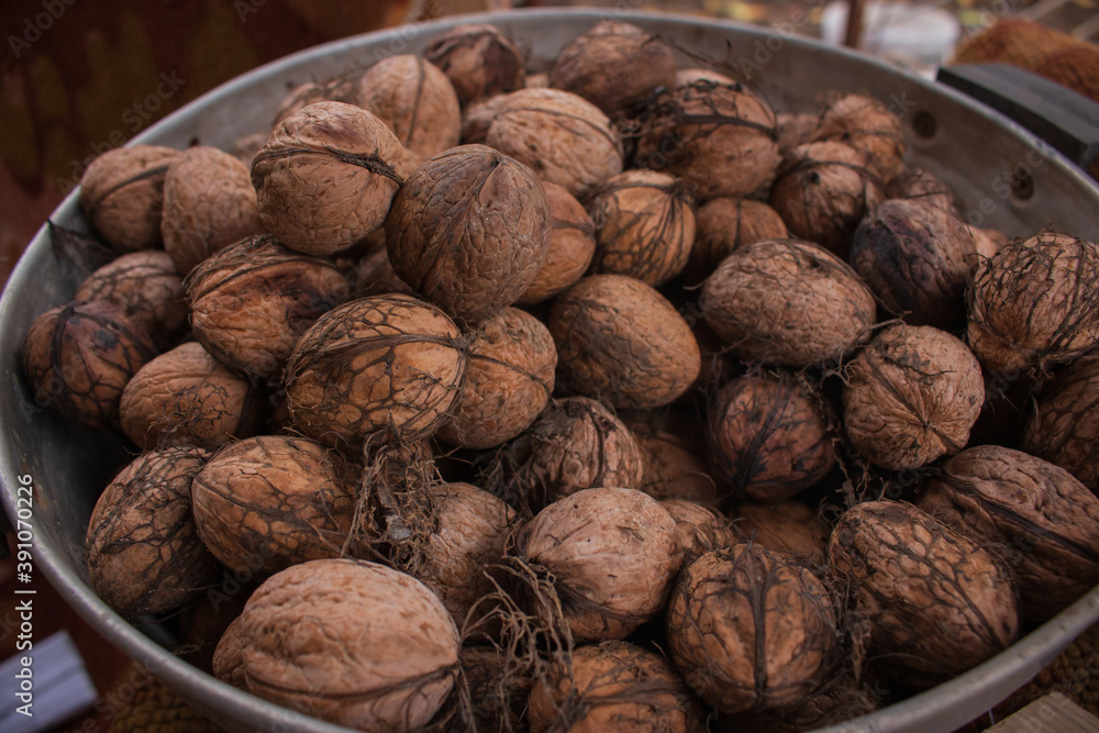 Group of walnuts. Close up of walnuts. Autumn harvest. Dried nuts. Rural nature background. Raw healthy food. Nuts shell. Tasty organic snack. Vegetarian food. Group of walnuts. Close up of walnuts. Autumn harvest. Dried nuts. Rural nature background. Raw healthy food. Nuts shell. Tasty organic snack. Vegetarian food.