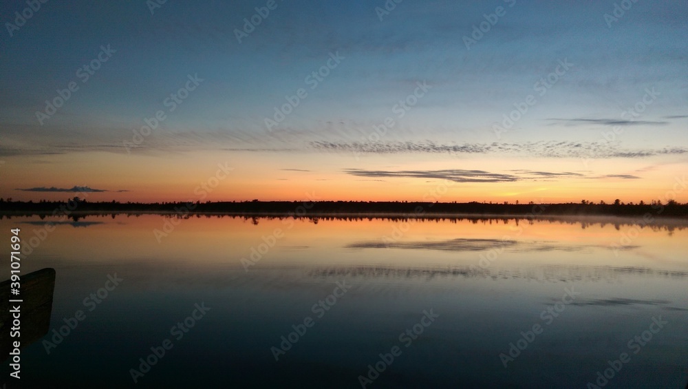 Obraz premium sunset over the river