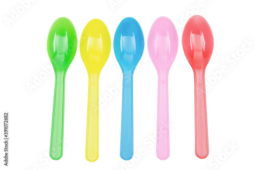 Colorful plastic spoons collection for party isolated on white