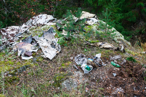 big amount of trash in forest, global environment issues