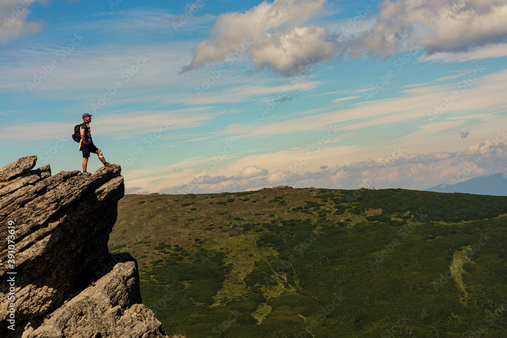 A man on one of the peaks of Carpathian beauties, Carpathian mountains, Montenegrin ridge, Eared Stone mountain.