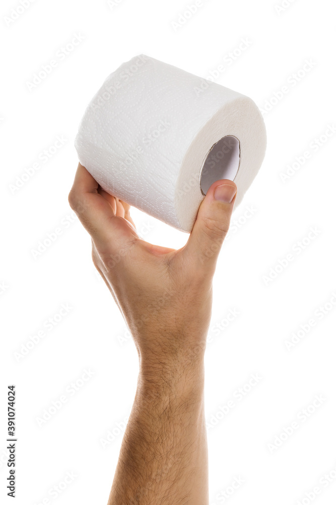 Fototapeta premium Hand holds roll of toilet paper isolated on white background, closeup