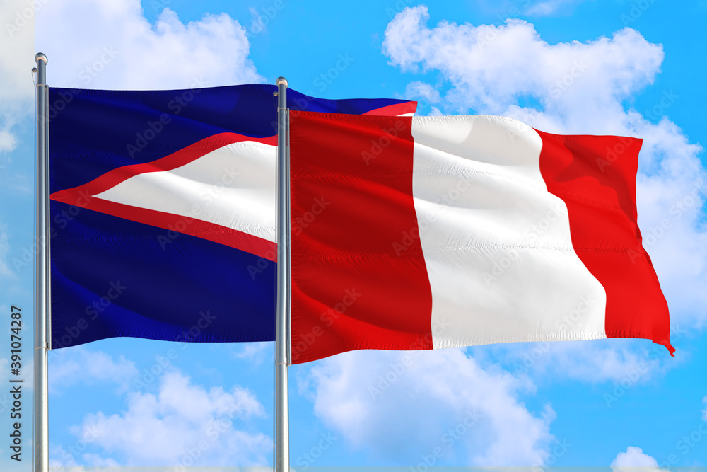 Peru and American Samoa national flag waving in the windy deep blue sky. Diplomacy and international relations concept. Peru and American Samoa national flag waving in the windy deep blue sky. Diplomacy and international relations concept.