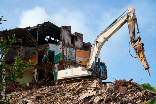 Dismantling and demolition of buildings and structures.