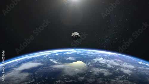 An asteroid flies close to the Earth. Asteroid appears in the frame, rotates and quickly flies away. Starry sky. 4K. Stars twinkle. 3d rendering. photo