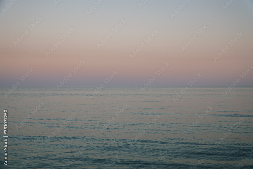 Sunset sky over estuary or sea Sunset sky over estuary or sea
