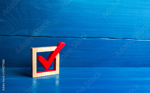 Red voting tick in a box. Checkbox. Presidential or parliamental democratic elections, referendum. Social poll. Rights and freedoms. Voting. Lawmaking. Approval symbol photo