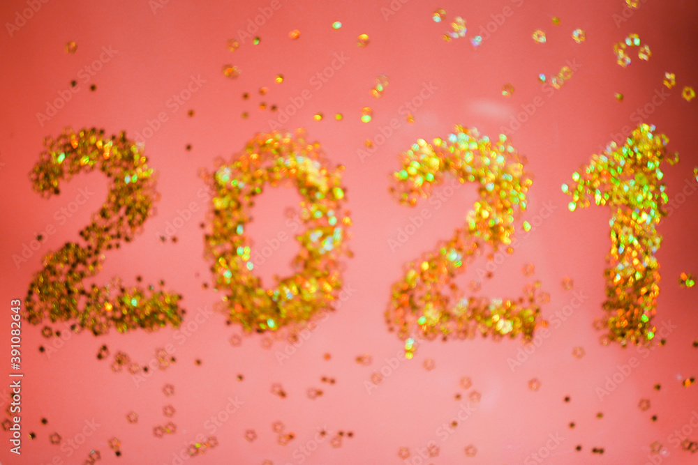 Blurry 2021 numbers. Shiny Golden glitters. Red background. New Year wallpaper Blurry 2021 numbers. Shiny Golden glitters. Red background. New Year wallpaper