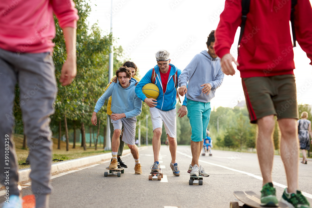 portrait of young sportive team of teenagers with skateboards, caucasina boys engaged in sport, skateboarding, sport concept portrait of young sportive team of teenagers with skateboards, caucasina boys engaged in sport, skateboarding, sport concept