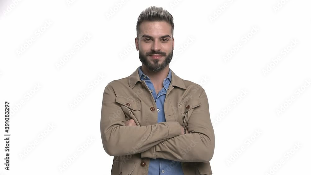 happy young man in blue denim shirt crossing arms and smiling isolated on white background in studio happy young man in blue denim shirt crossing arms and smiling isolated on white background in studio