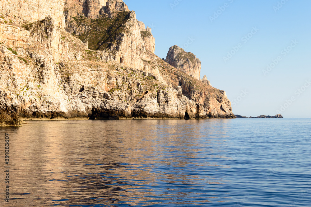 The rocky coast of the little island of Marettimo a preserved maritime area near Sicily in the Mediterranean sea The rocky coast of the little island of Marettimo a preserved maritime area near Sicily in the Mediterranean sea