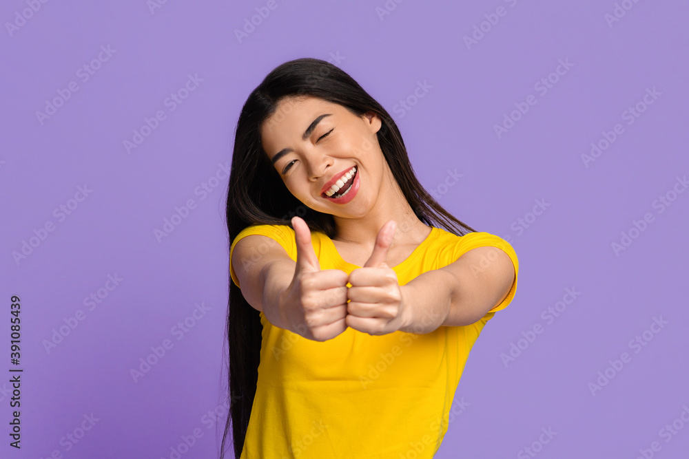 I Like It. Joyful Young Asian Woman Showing Thumbs Up At Camera I Like It. Joyful Young Asian Woman Showing Thumbs Up At Camera