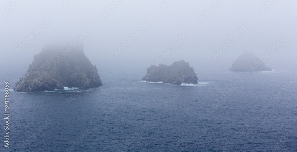 View of Ouessant island coast in a foggy day