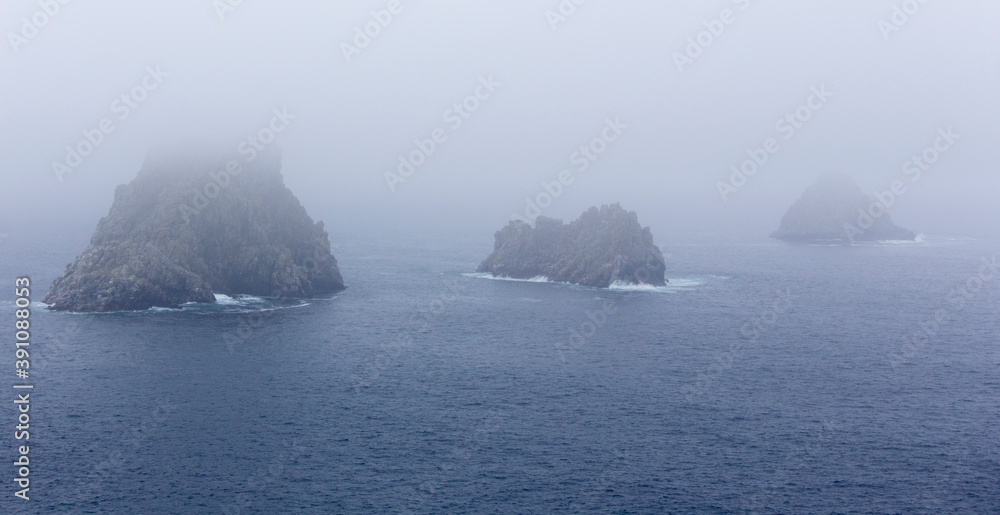 View of Ouessant island coast in a foggy day View of Ouessant island coast in a foggy day