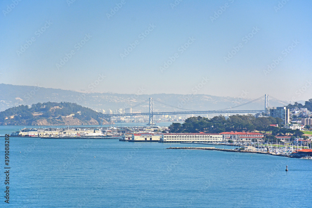 Looking at the Fisherman's Wharf with the San Francisco Oakland Bay Bridge in the background