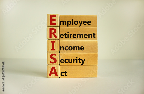 Wooden blocks and cubes with words 'ERISA - employee retirement income security act'. Beautiful white background. Copy space. Business concept. photo