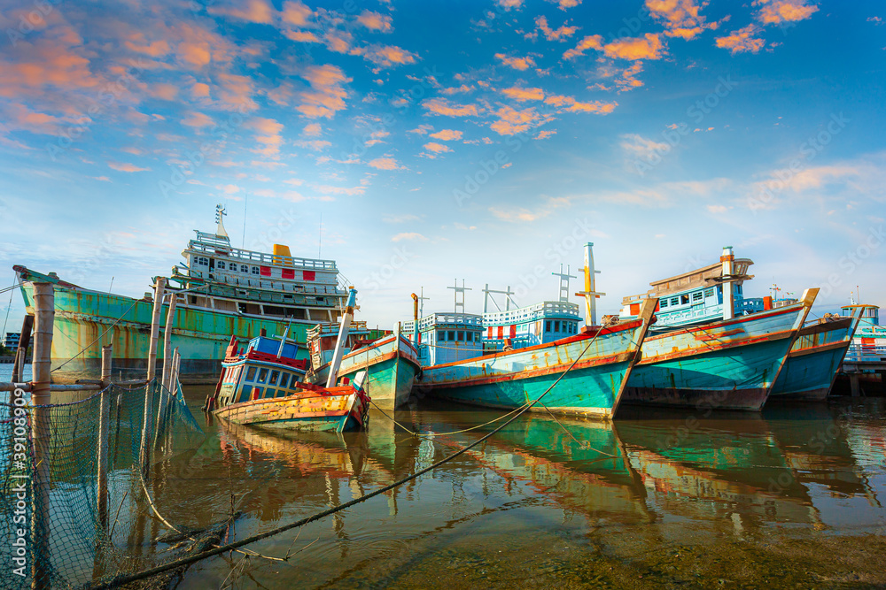 Many boats moored in sunrise morning time at Chalong port, Main port for travel ship to krabi and phi phi island, Phuket, Thailand Many boats moored in sunrise morning time at Chalong port, Main port for travel ship to krabi and phi phi island, Phuket, Thailand