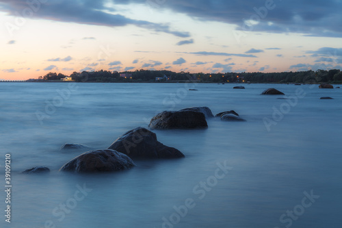 Sunset over the sea. Stones on the foreground. Long exposure © yegorov_nick