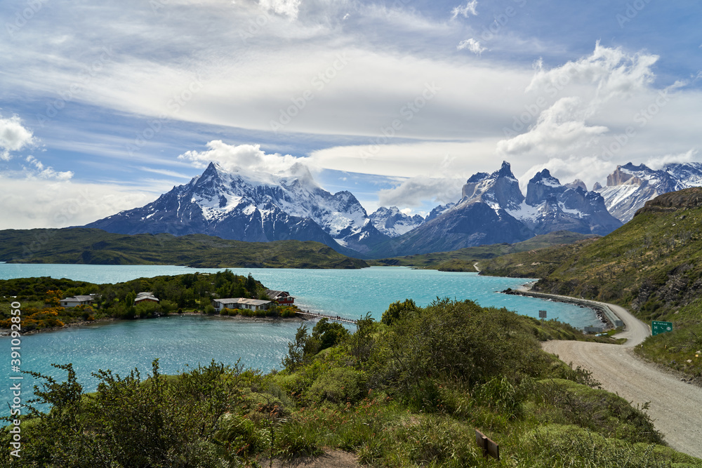 Cuernos, Horns of torres del paine covered with snow,  torres del paine national park in the Andes, southern Chile, south America, towering over the turquoise water of lake Pehoe with dramatic clouds