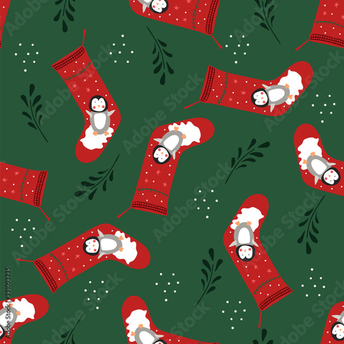 Seamless pattern of Christmas stockings with cute penguins on a dark green background.