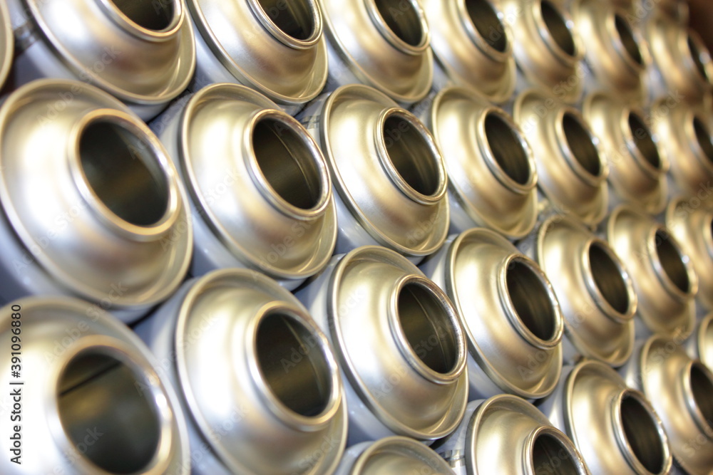 Aerosol cans in factory awaiting filling Aerosol cans in factory awaiting filling
