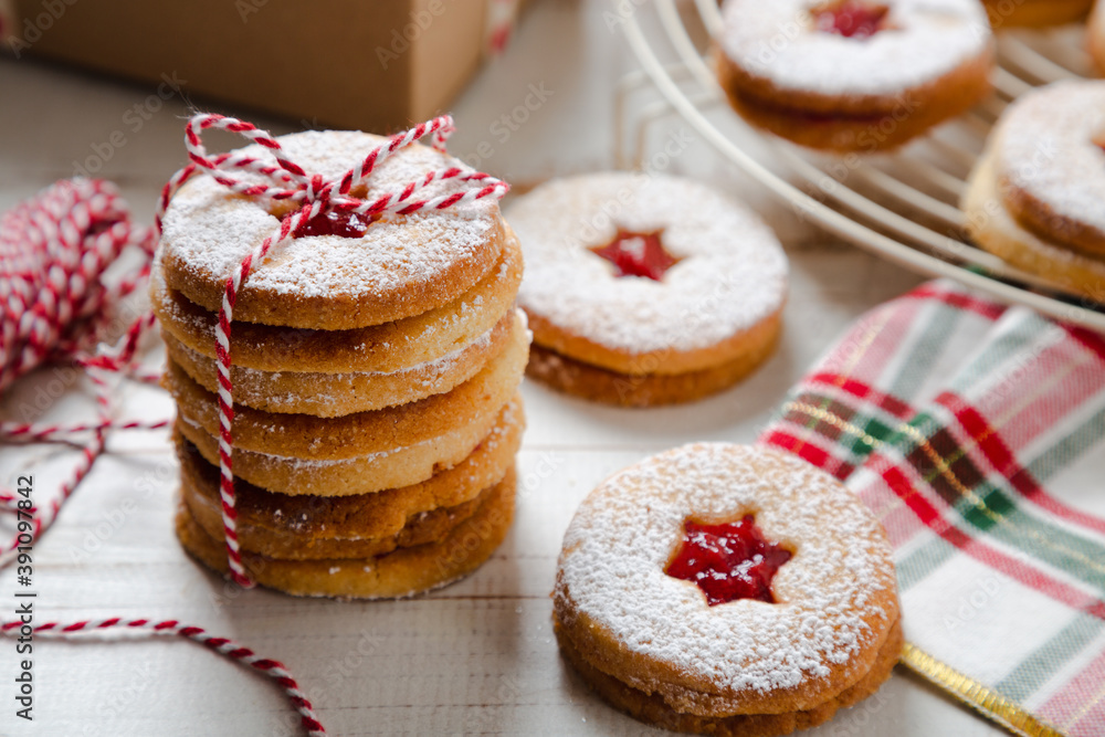 Stack of Linzer Christmas cookies tied to give a present Stack of Linzer Christmas cookies tied to give a present