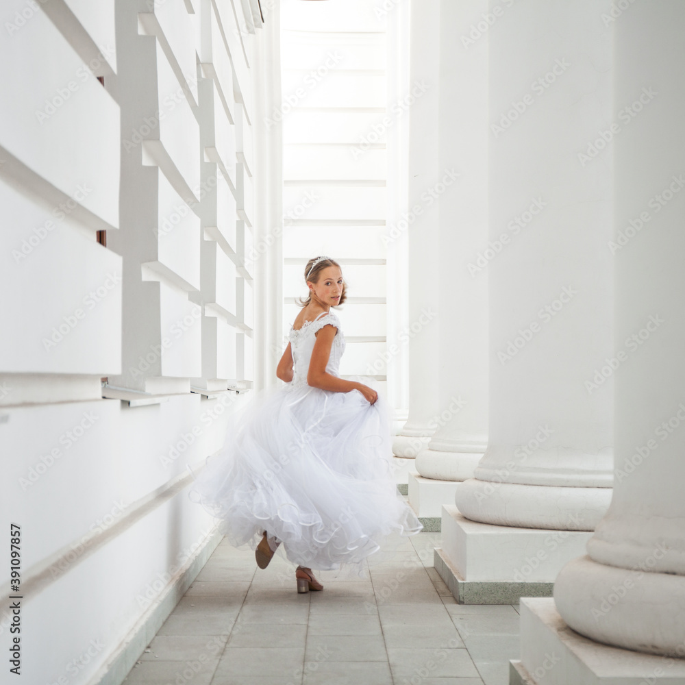 Portrait of a young woman in a white ball gown Portrait of a young woman in a white ball gown