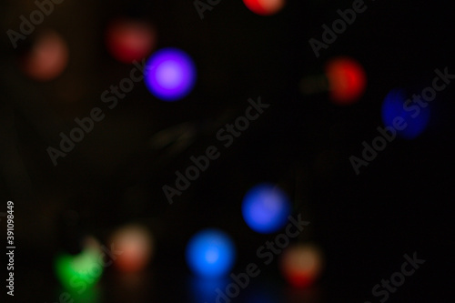bokeh lights colorful lights blurred in the background multicolored light background on black