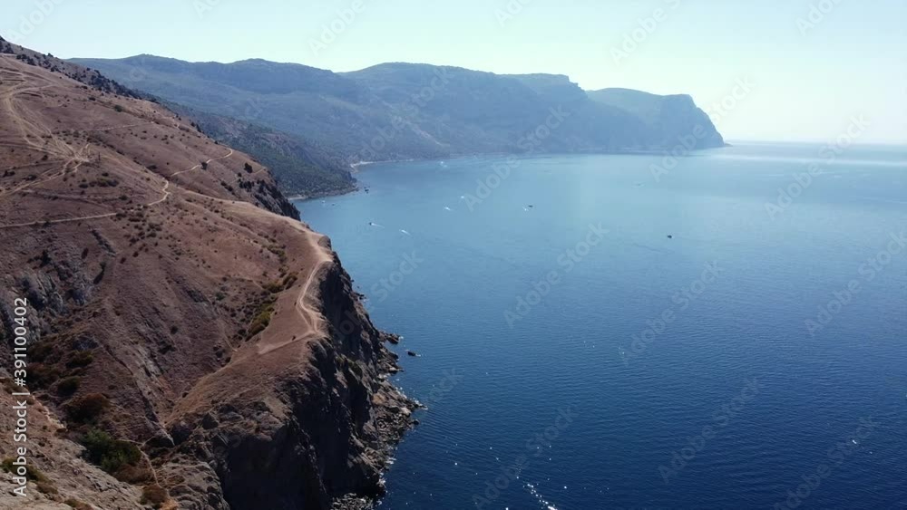 Flight over the mountains overlooking the sea cape. Flight over the mountains overlooking the sea cape.