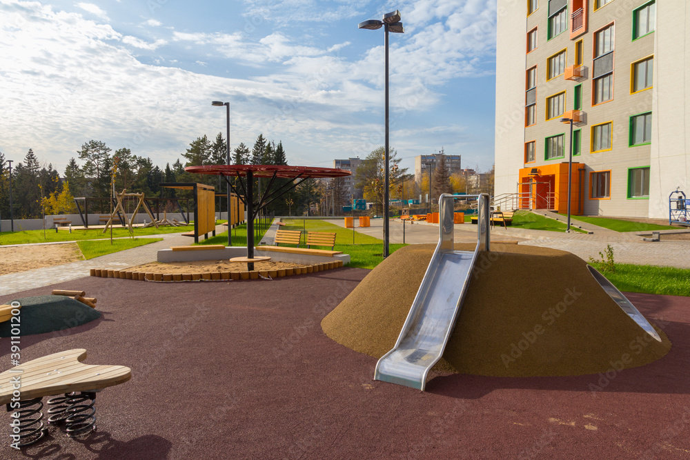 Naklejka premium A new playground near an apartment building.