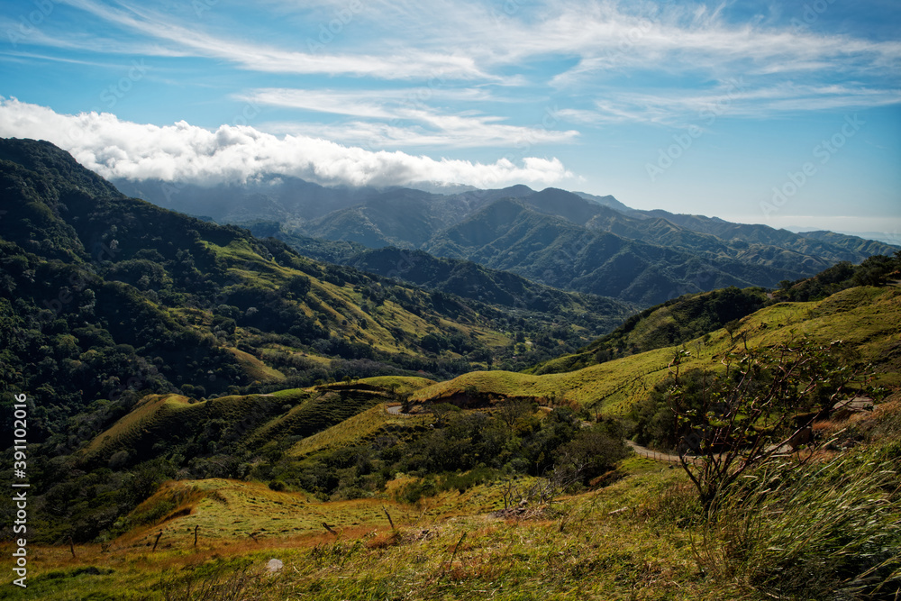 Landscape from Monte Verde in Costa Rica, mountains and green forests, rainforest and bue sky with the clouds Landscape from Monte Verde in Costa Rica, mountains and green forests, rainforest and bue sky with the clouds