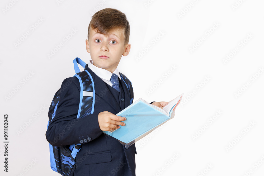The student opened the book and looks at the camera. Isolated on white background. The student opened the book and looks at the camera. Isolated on white background.