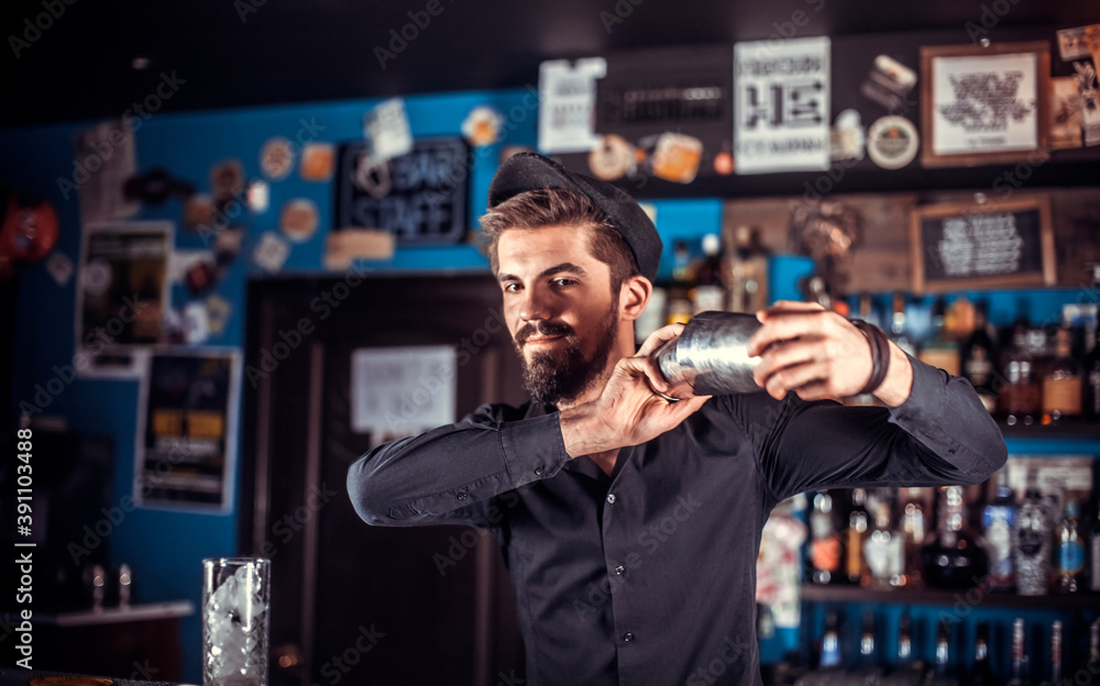 Bartender creates a cocktail on the public house