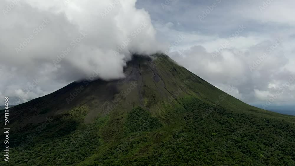 Beautiful cinematic aerial view of the Arenal volcano and the Lagoon in Costa Rica Beautiful cinematic aerial view of the Arenal volcano and the Lagoon in Costa Rica