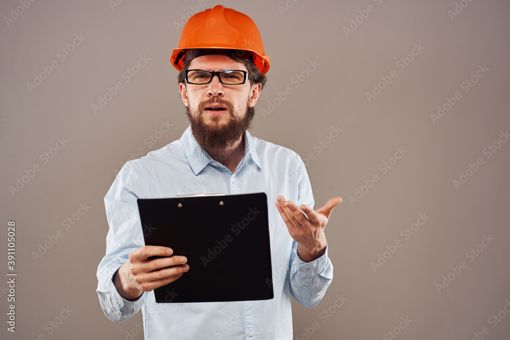 emotional worker man in orange paint documents service construction beige background emotional worker man in orange paint documents service construction beige background