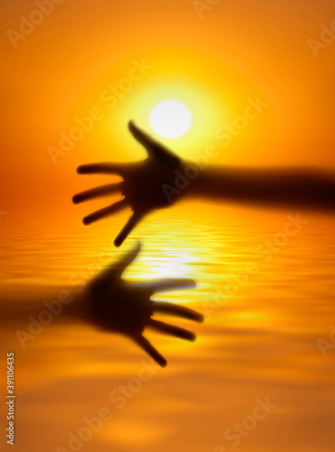golden sunset and sea and hands shadows