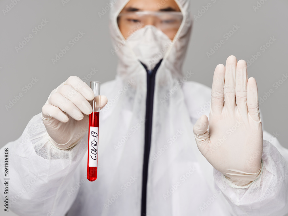 A male laboratory assistant holds in his hands analyzes research diagnostics close-up A male laboratory assistant holds in his hands analyzes research diagnostics close-up